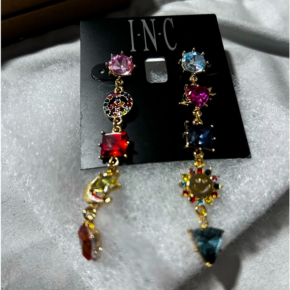Cute dangling pierced earrings. Gold tone. From Macys.
